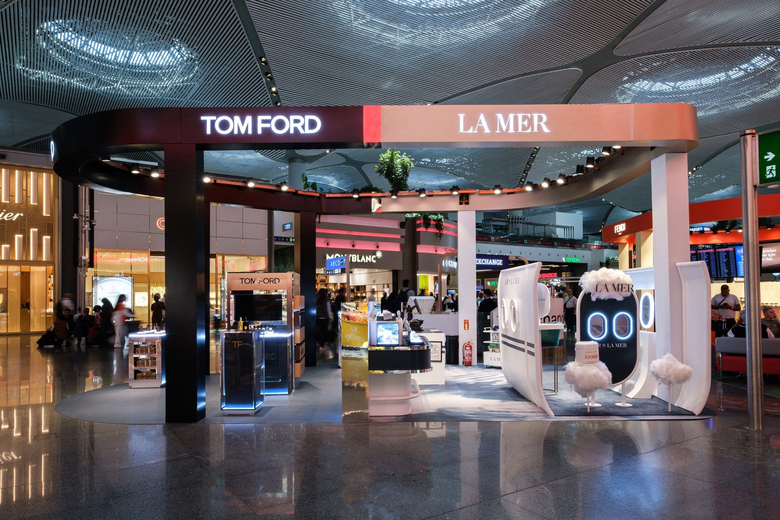 Tom Ford and La Mer pavilion in the main duty free hall at Istanbul Airport, travellers passing.