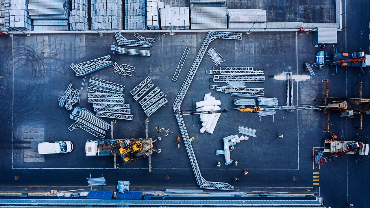 Aerial view of a construction site with steel trusses and machinery, Istanbul.