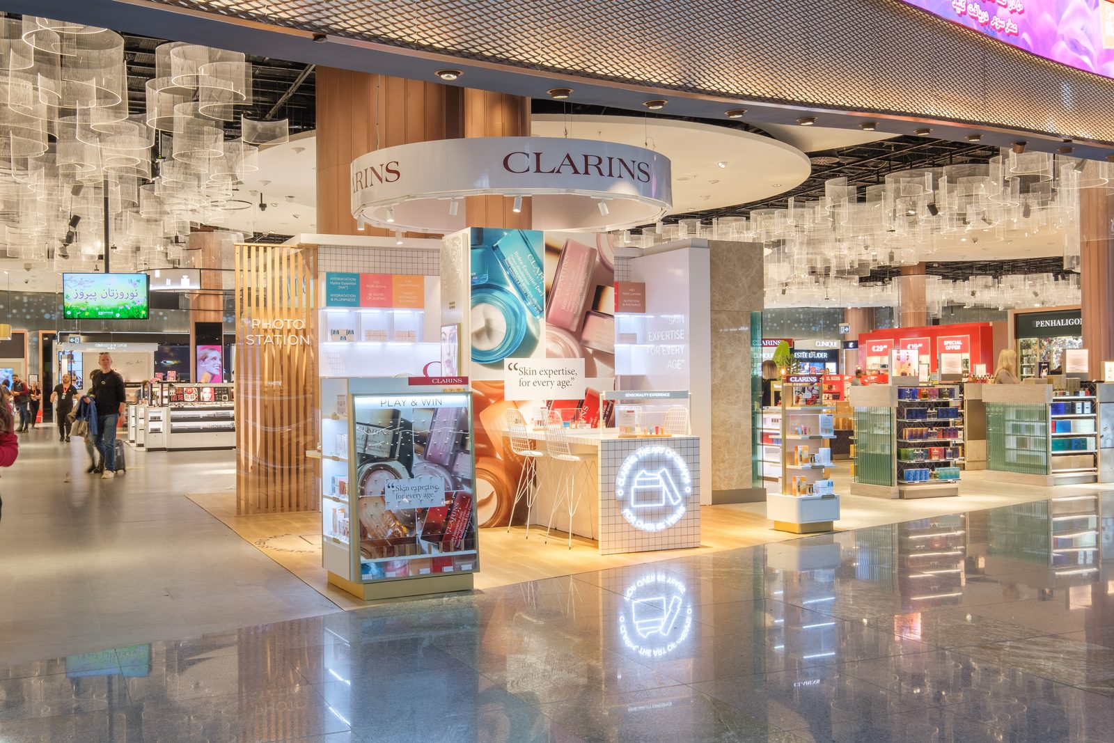 Clarins corner with its circular logo installation in the Istanbul Airport duty free hall.