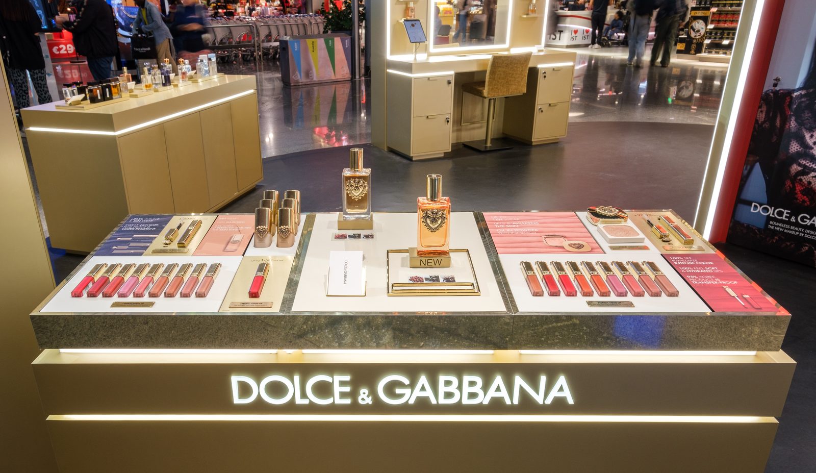 Dolce & Gabbana makeup counter with lipsticks and palettes laid out at Istanbul Airport duty free.