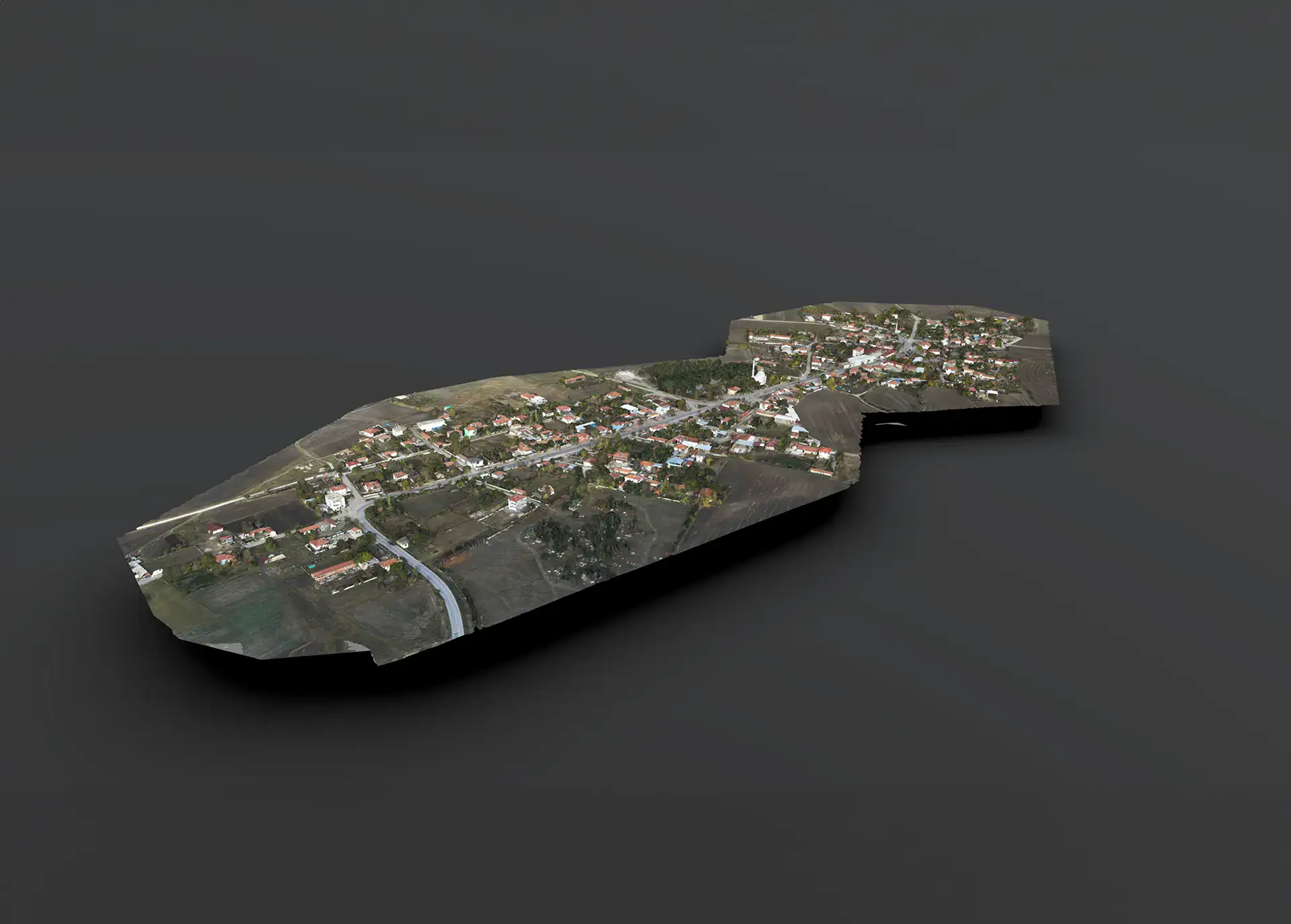 Photogrammetry model of a village and surrounding farmland captured by drone survey.