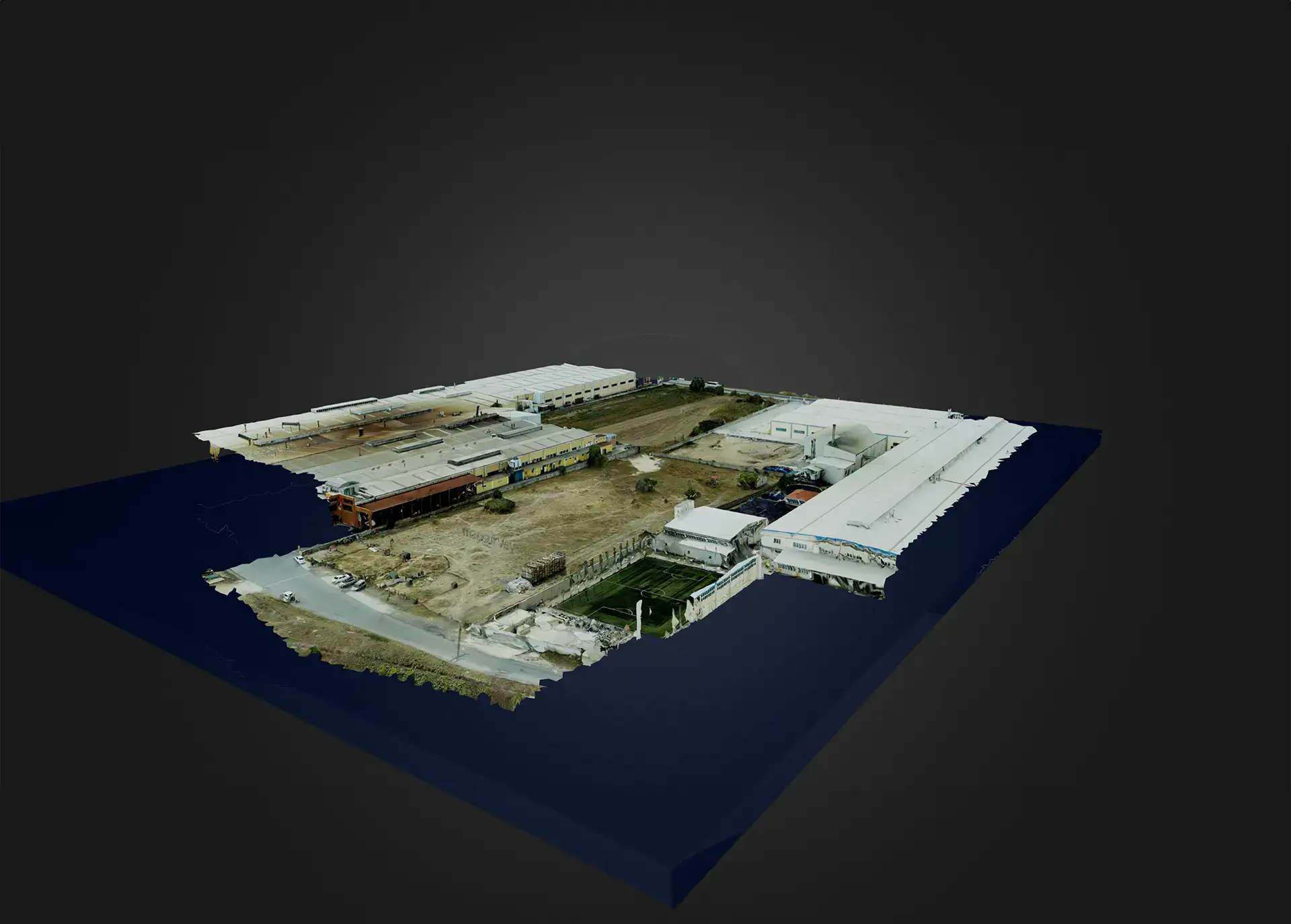 Photogrammetry model of an industrial plant and its grounds rendered as a 3D terrain block.