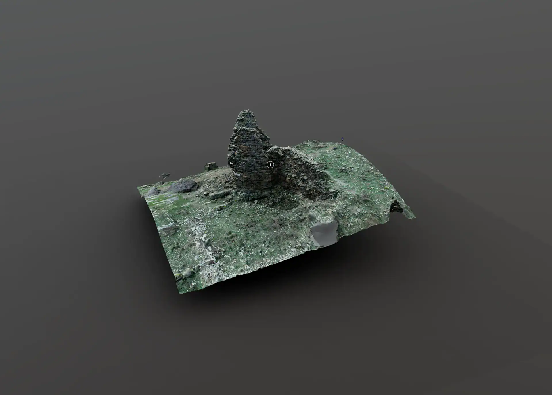Remnants of an old stone structure covered in moss and lichen, situated on a flat surface with a dark background.