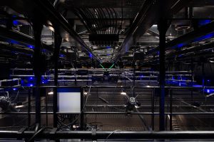 Microscope laboratory with advanced lighting and equipment in a high-tech scientific research facility.