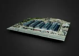 Aerial photograph of a modern industrial warehouse complex with multiple large buildings, parking areas, and surrounding infrastructure, captured for professional architectural and industrial photogra.