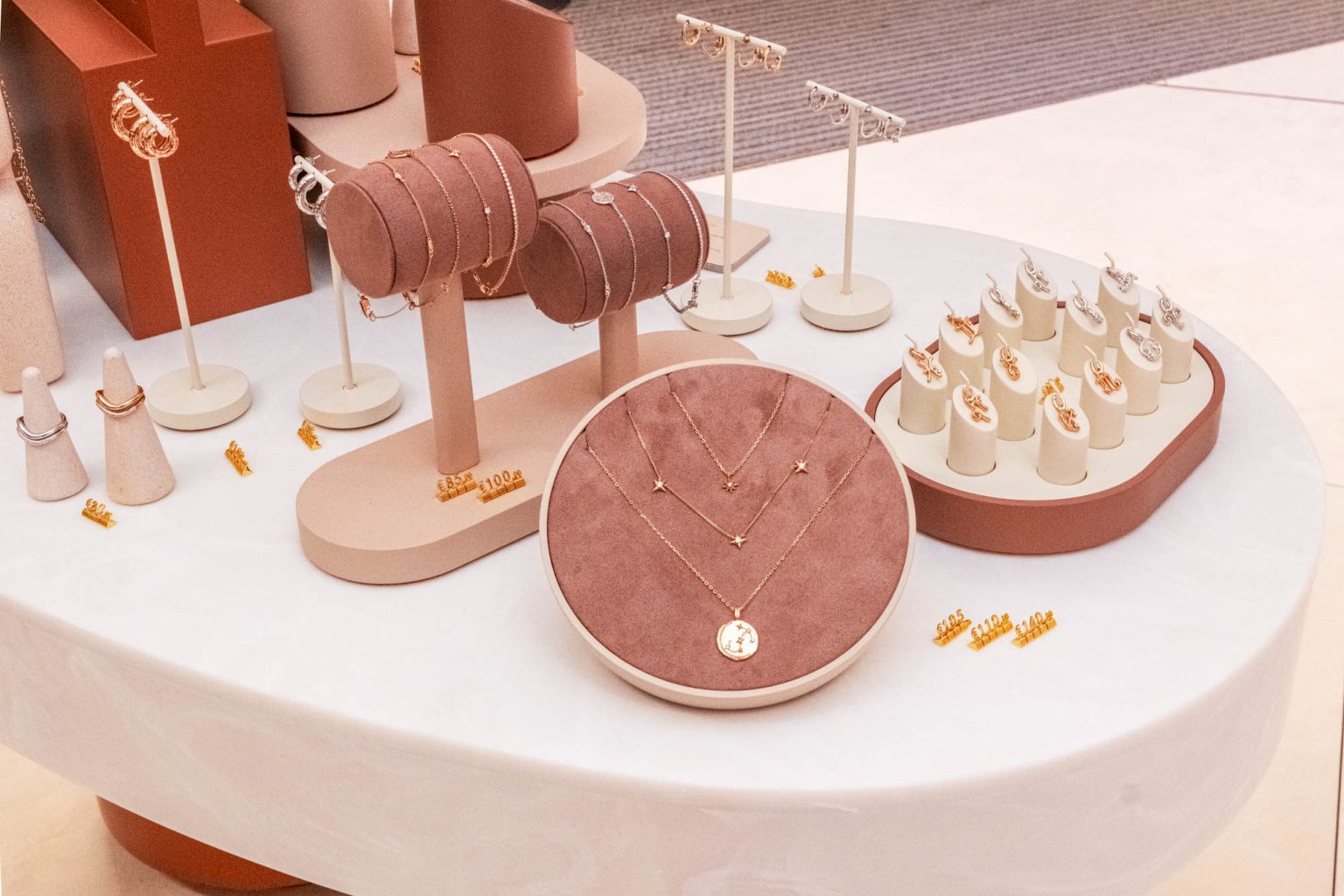 Elegant jewelry display setup for Astrid & Miyu launch event in Madrid.